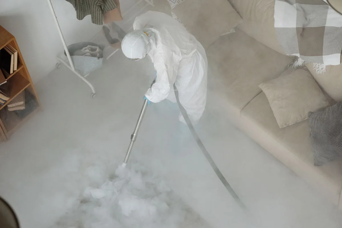 Biohazard cleanup technician in protective equipment, Ken-Mar, Wichita, KS